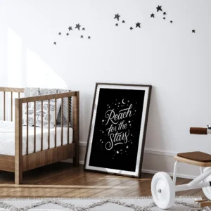Reach for the Stars black print in nursery with crib and stars decoration.