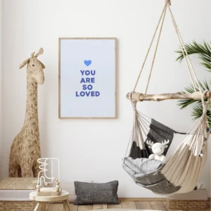 Cozy nursery with hammock and 'You Are So Loved' blue print wall art.