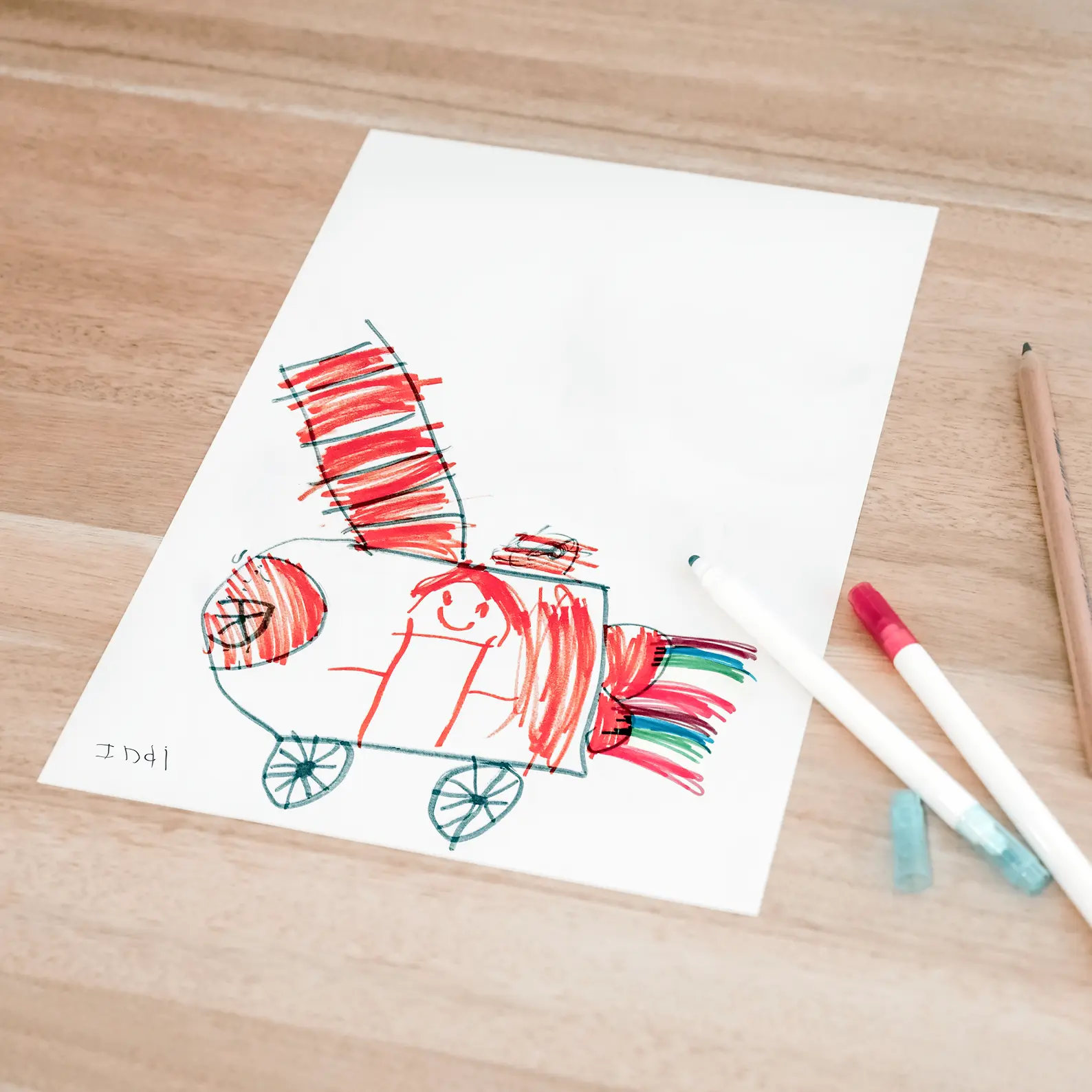 Child's artwork on paper with pens